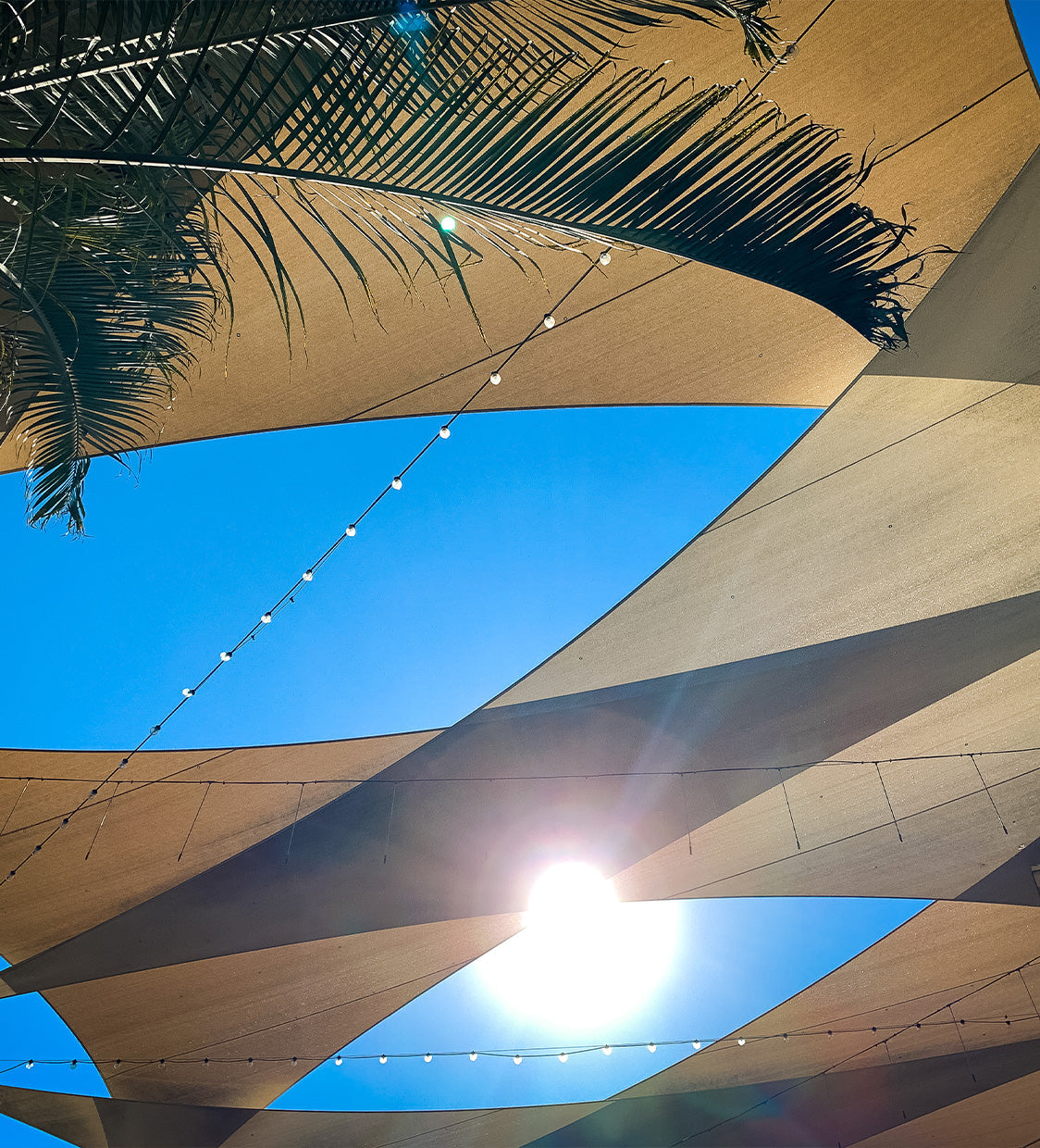 Umbrellas vs shade sails: Hotel & resort design