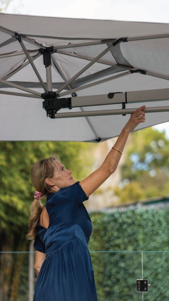 Operating the wall mounted umbrella